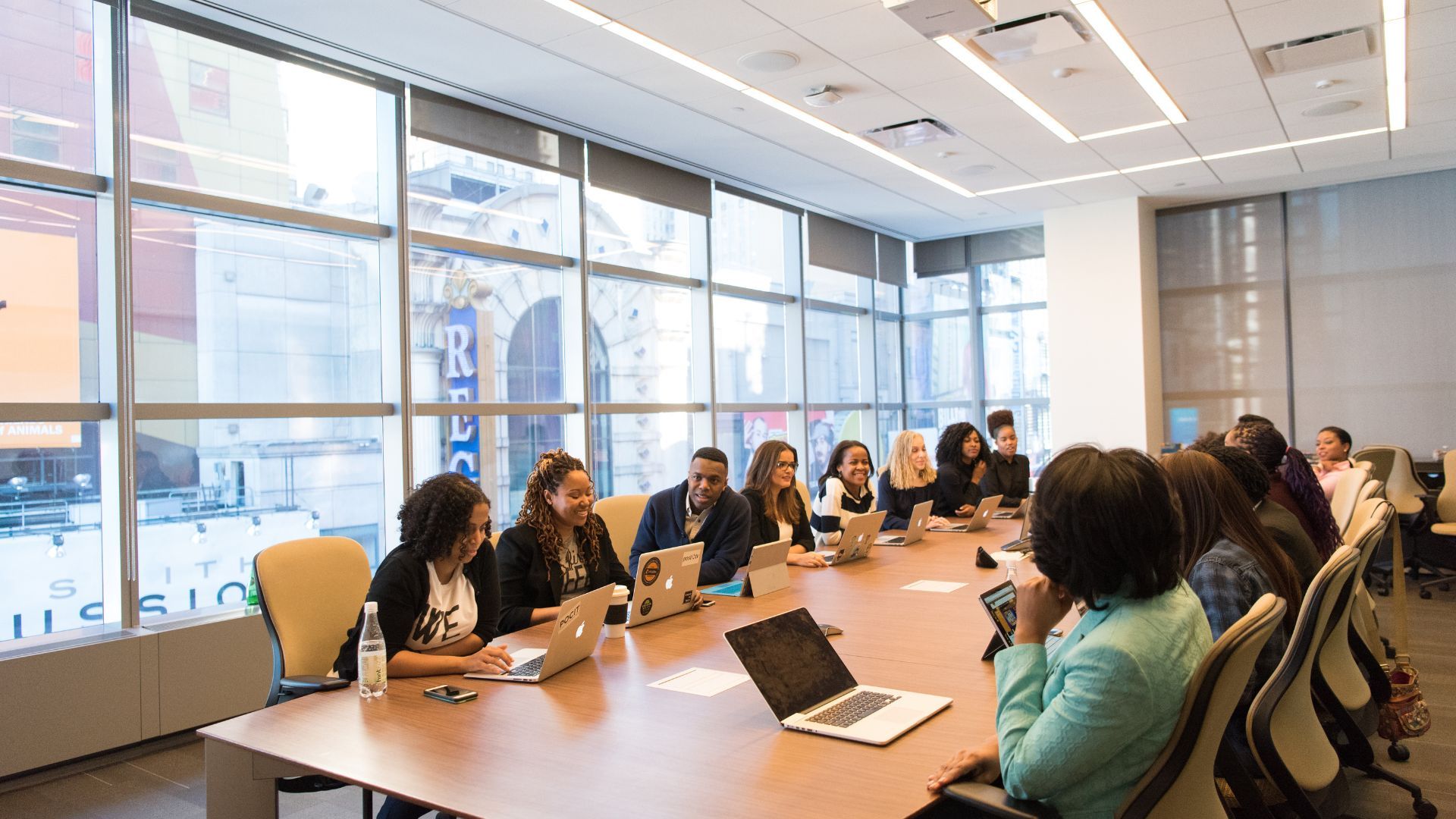 Meeting in a modern office with large windows and natural light